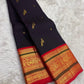Handwoven Kanchipuram Korvai saree with vermillion red and gold zari border detail