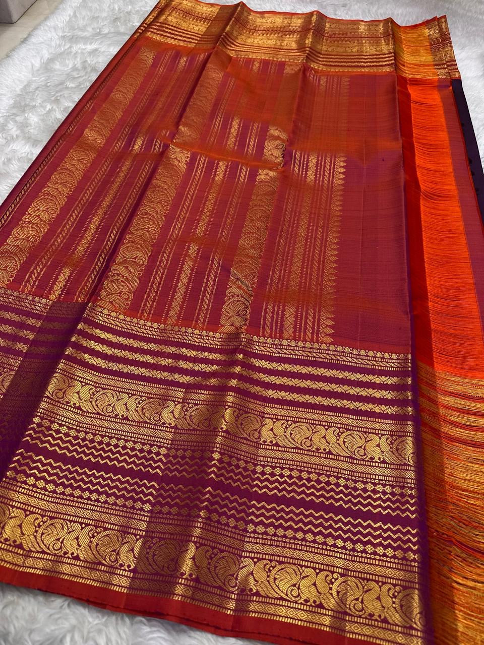 Mayil Butta peacock motif in gold zari on deep purple Varisaipet body