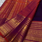Rust orange Varisaipet border with red silk thread woven motifs on deep purple Kanchi Pattu saree
