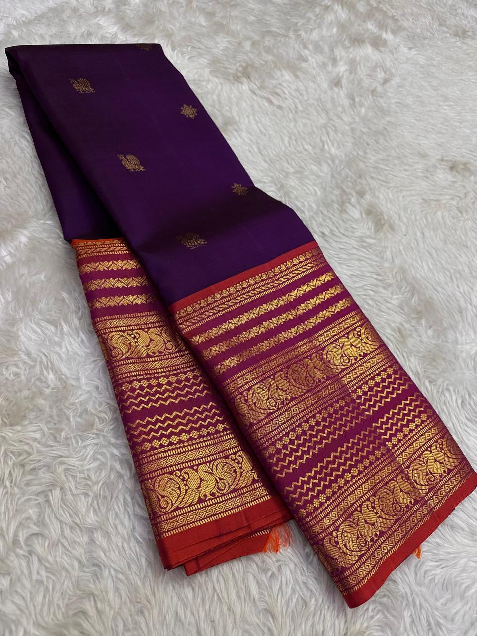 Close view of Varisaipet body showing Mayil Butta in gold zari on deep purple silk