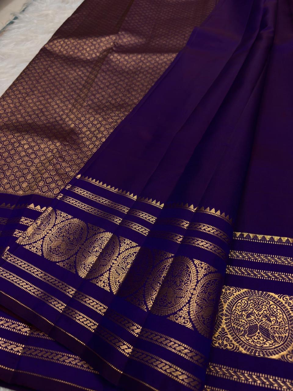 Radiant Neelam Blue pure silk Kanchipuram Varisaipet saree, ornate seer pallu unfolded.