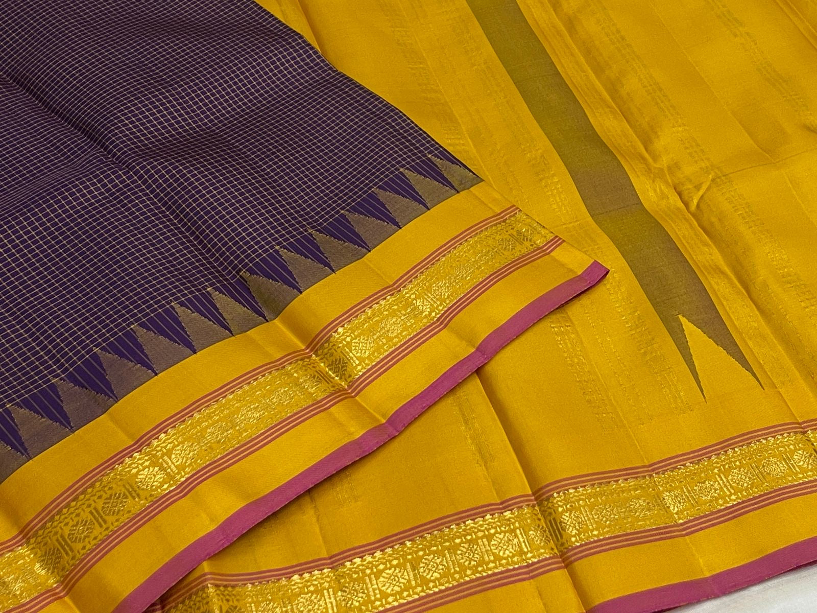 Deep Purple Zari Kattam saree laid flat showing the fine gold grid and yellow border