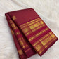 Layered antique-gold Varisaipet border with traditional woven motif registers.