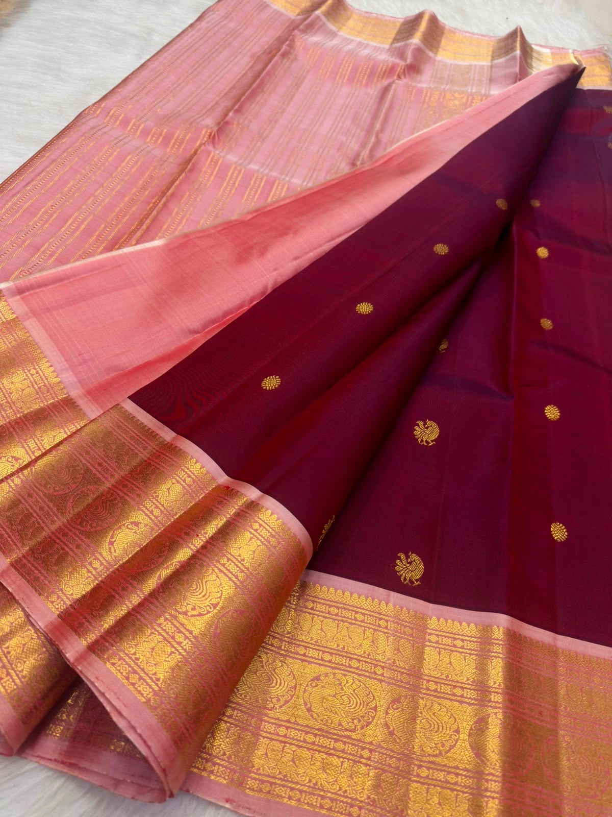Deep raspberry maroon KanchiPattu saree, Mayil and Chakram butta detail
