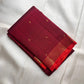 Deep Raspberry Maroon handwoven pure silk Kanjivaram Butta saree with antique-gold zari buttas.