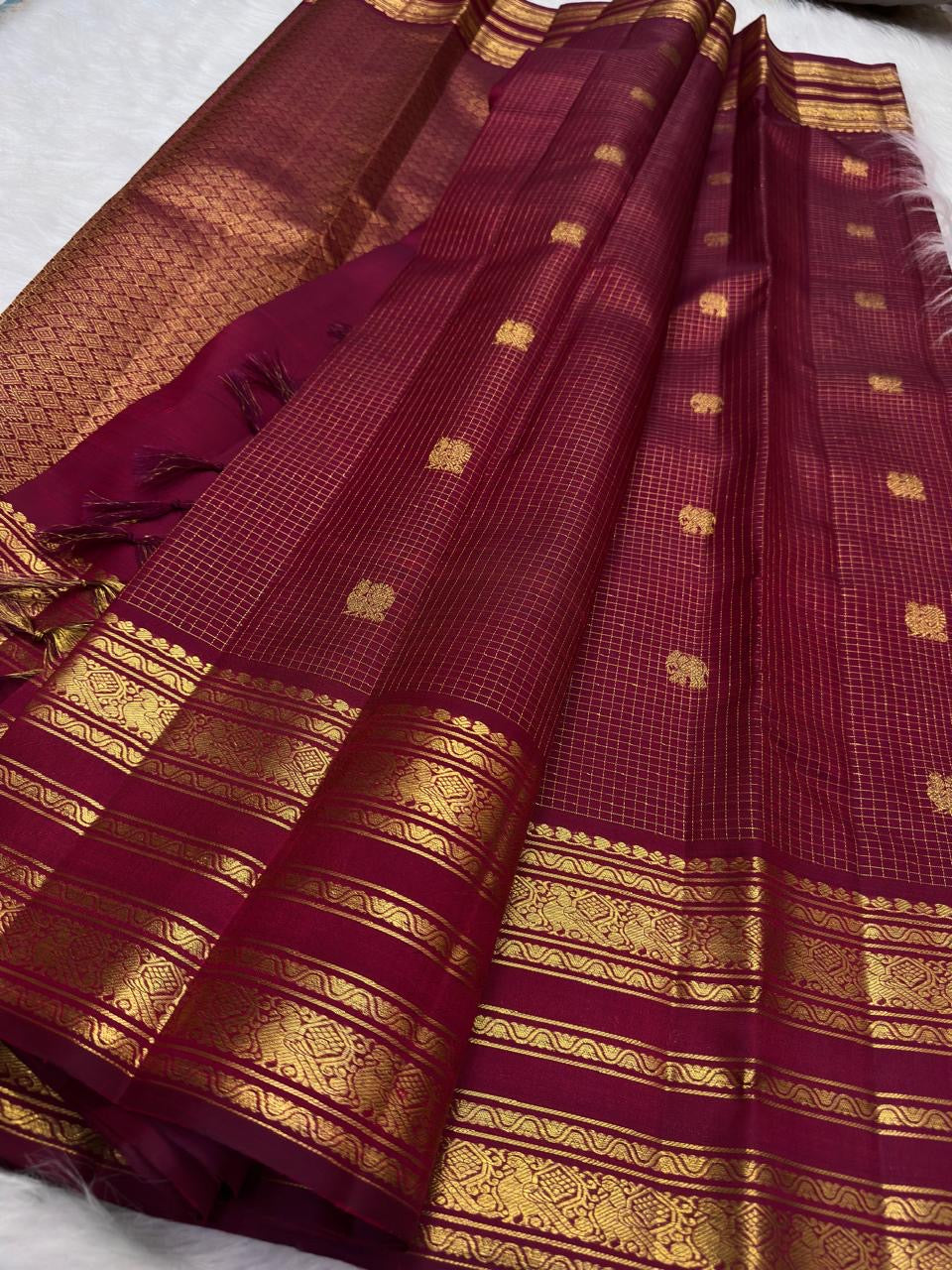 Deep Raspberry Maroon pure silk Kanjivaram Varisaipet saree with antique-gold zari checks and traditional motifs.