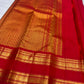 Deep raspberry pink handwoven Kanjipuram Rettapet saree, folded view with gold zari buttas