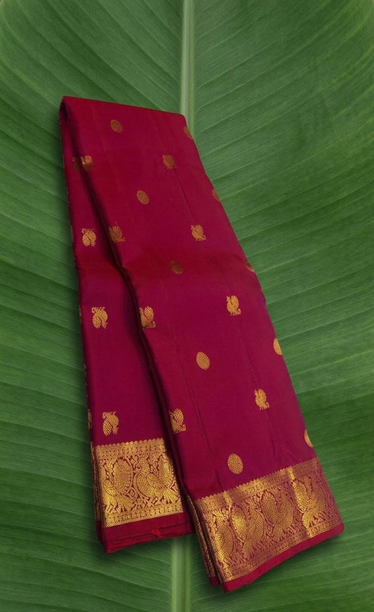 Deep Raspberry Pink Kanchipuram Silk Saree With Gold Zari Peacock Border And Mayil Chakram Butta