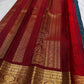 Subtle Deep Red accent edging the gold zari border of the Peacock Teal Kancheepuram saree.