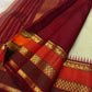 Close view of geometric and ornamental gold zari detailing in the Varisaipet border.
