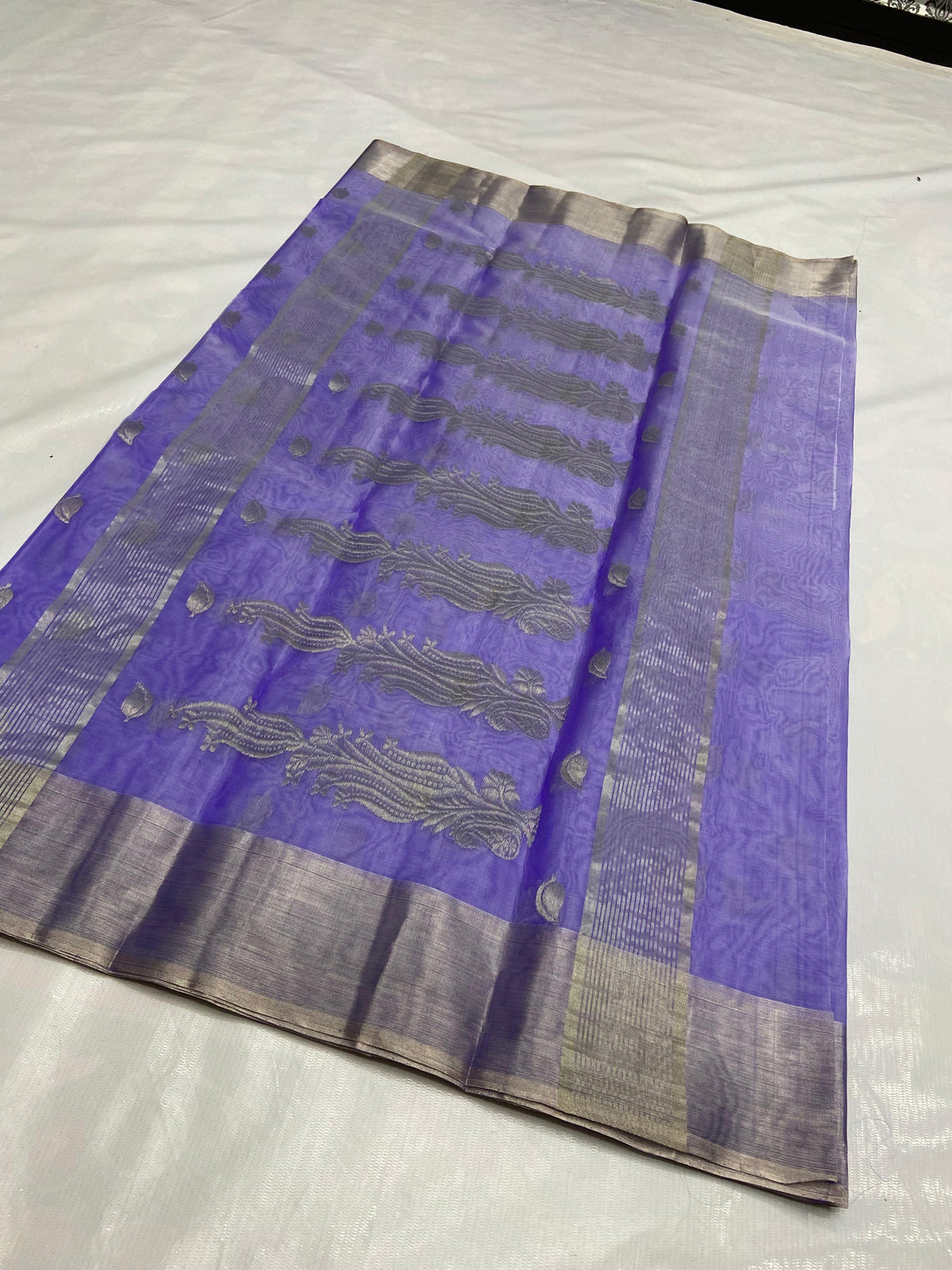 Amethyst lavender Chanderi saree opened to show the elongated silver-toned paisley motifs on the pallu