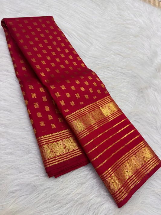 Broad gold zari border detail framed by the vivid Vermilion Pinkish Red silk body