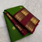 Deep ruby rettapet border on bright green Kanjivaram silk saree USA Idam Living