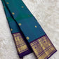 Kanchipattu silk saree in korvai with deep teal blue border weave traditional zari detail