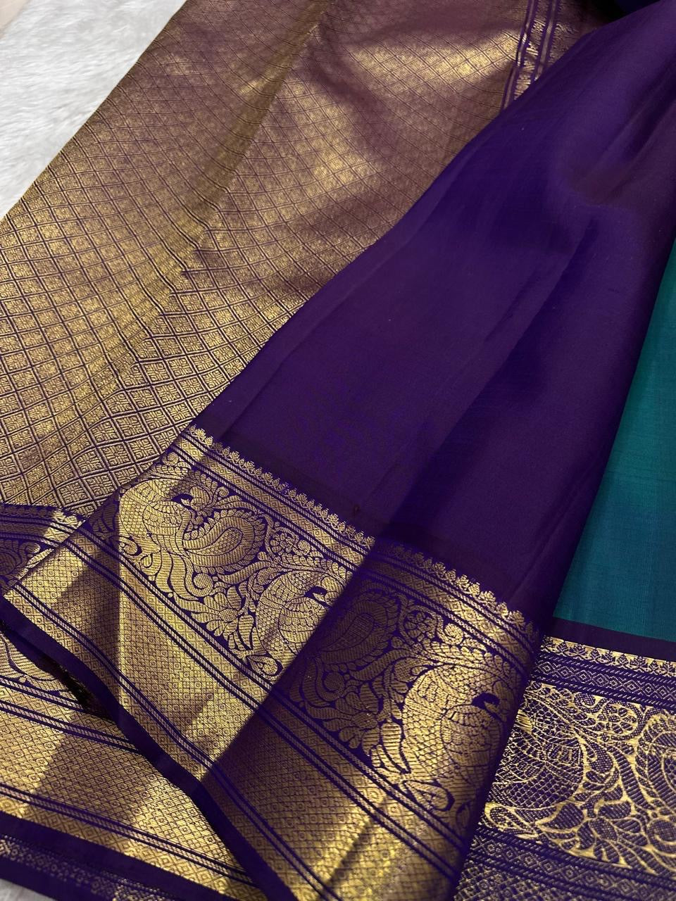 Kanchipattu silk saree in korvai with deep teal blue border weave traditional zari detail