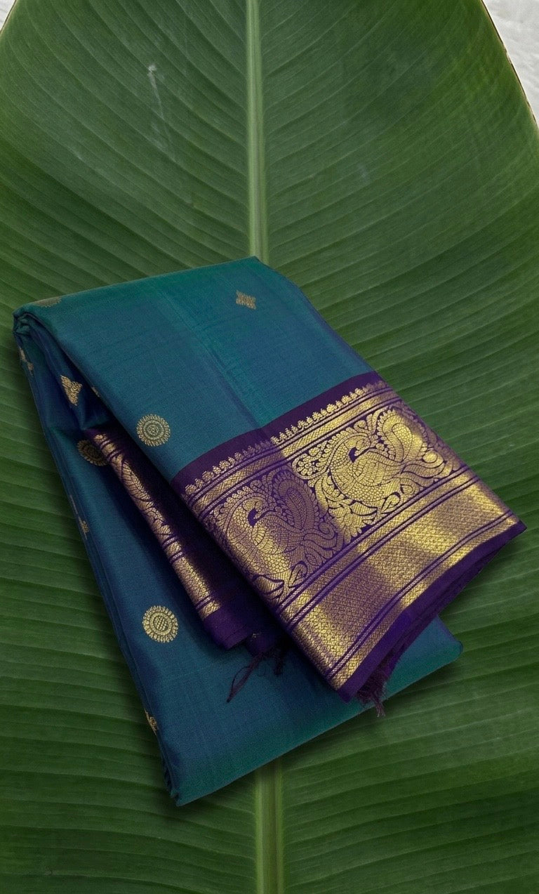 Kanchipuram silk saree in korvai with deep teal blue border weave folded view