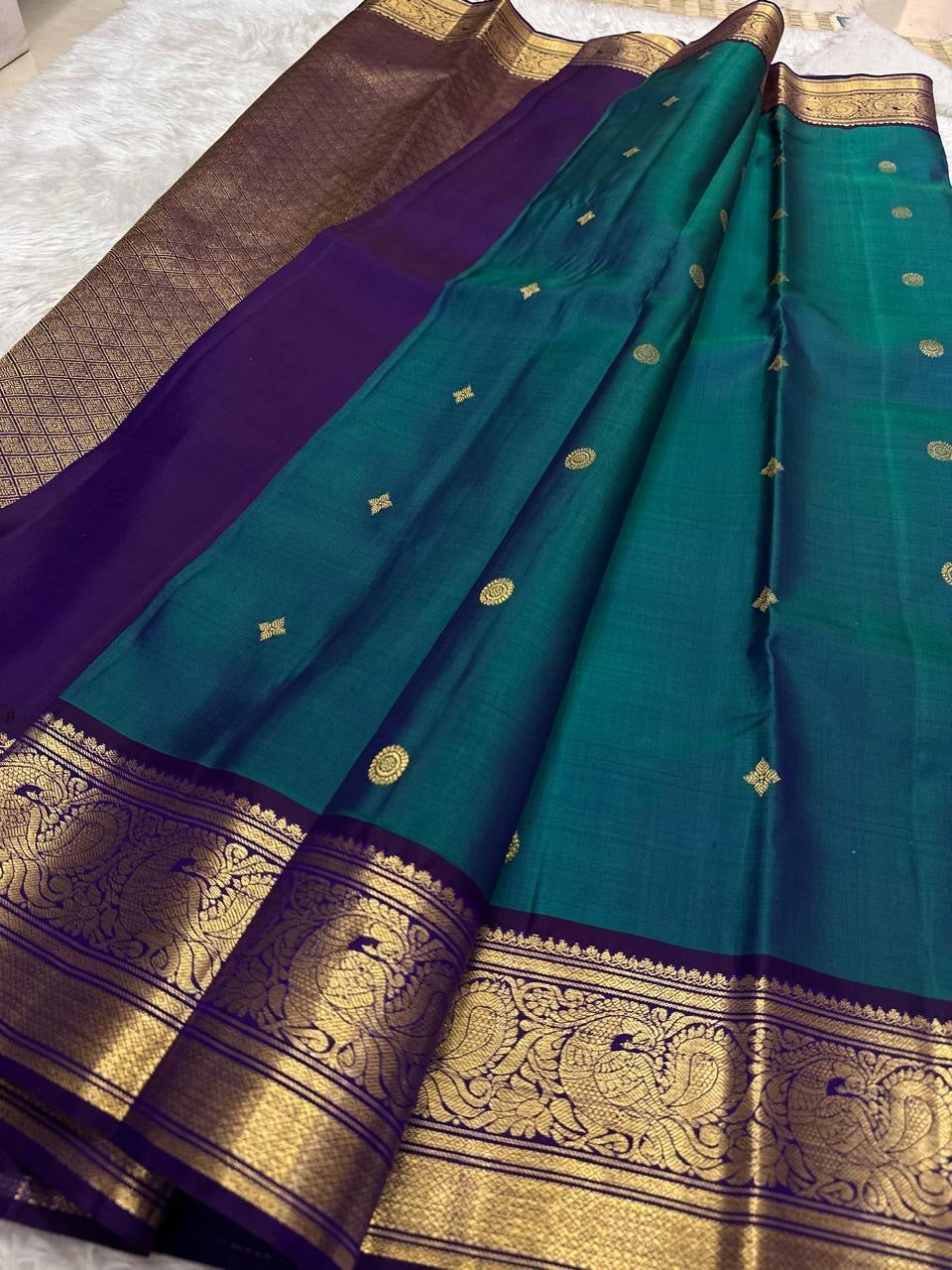 Kanchipattu silk saree in korvai with deep teal blue border weave traditional zari detail