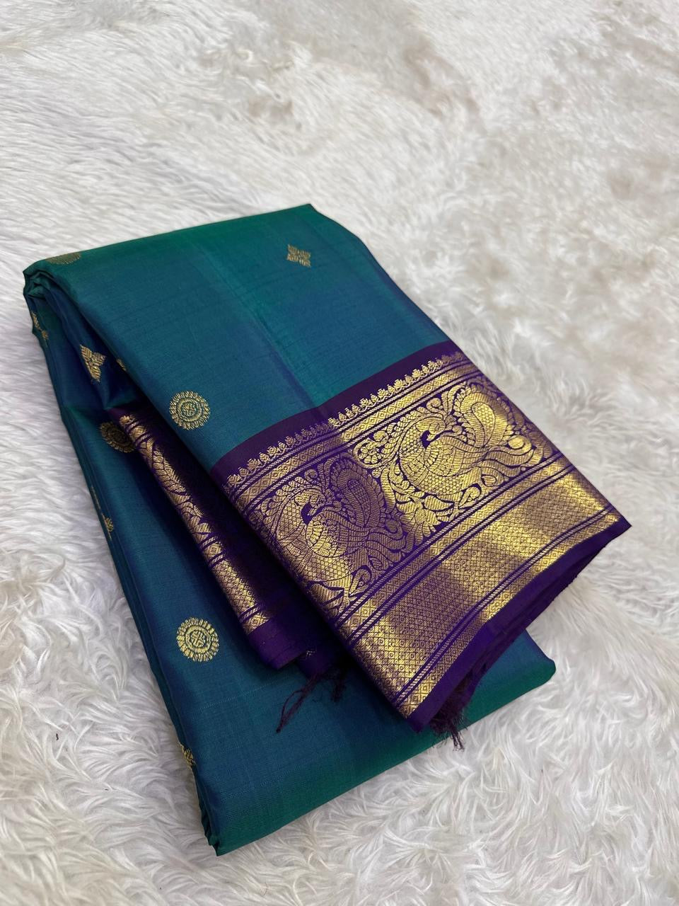 Kanchipattu silk saree in korvai with deep teal blue border weave traditional zari detail