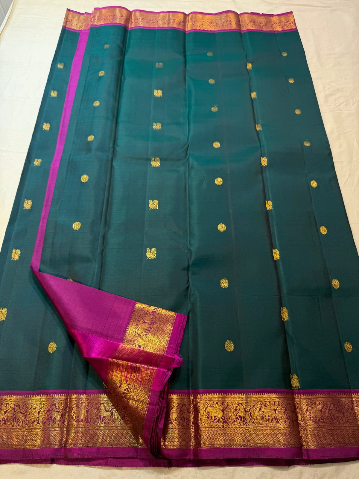 Rani Pink contrast border with broad traditional gold zari.