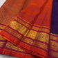 Deep violet silk body meeting the vermilion and gold zari border