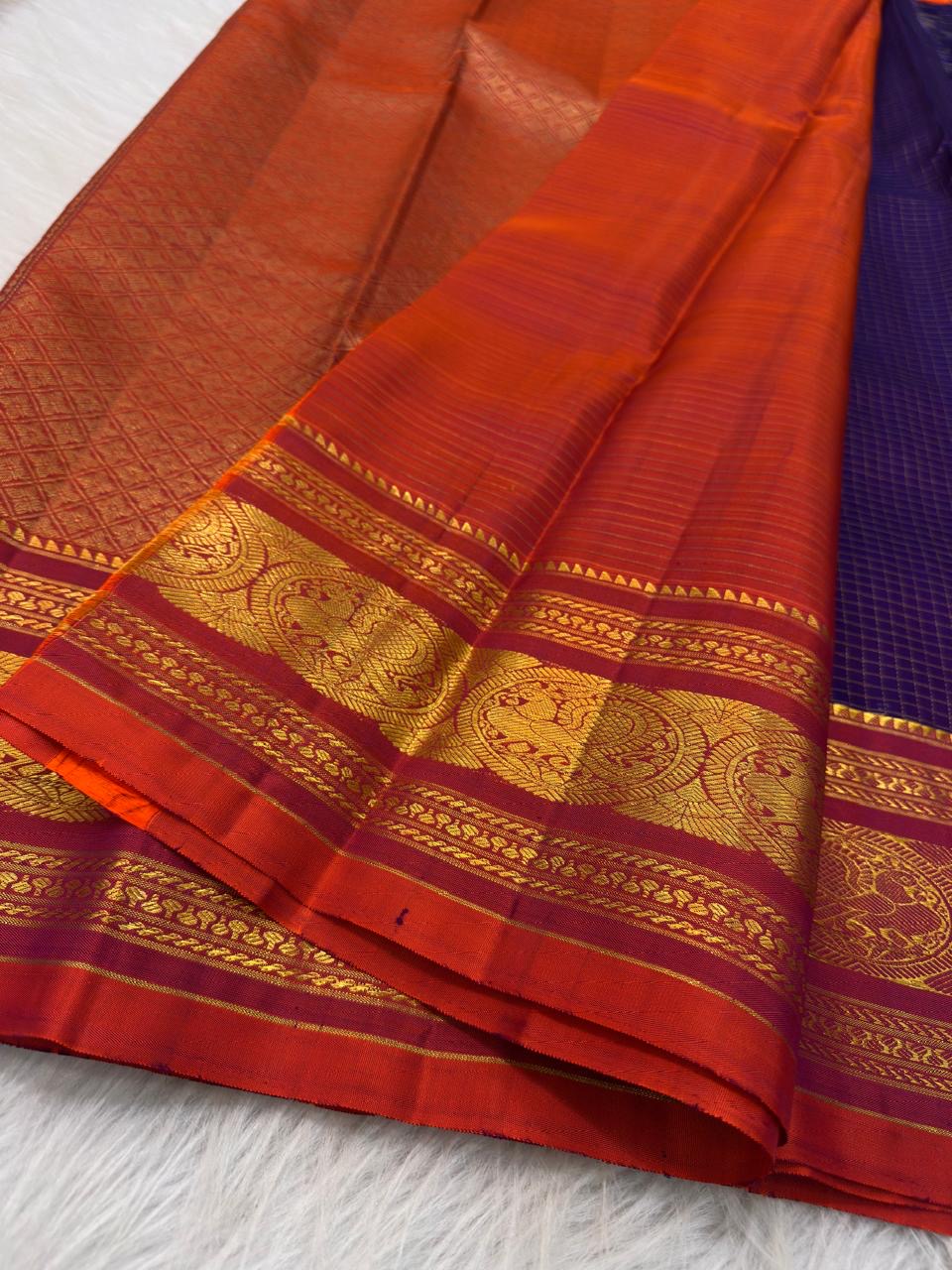 Deep violet silk body meeting the vermilion and gold zari border