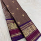 Close view of gold Mayil zari motifs and ornamental foliage on Deep Violet Varisaipet border.