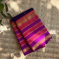 Deep violet Kanchipuram silk body with fine classic-gold zari grid lines and individually spaced zari buttas.