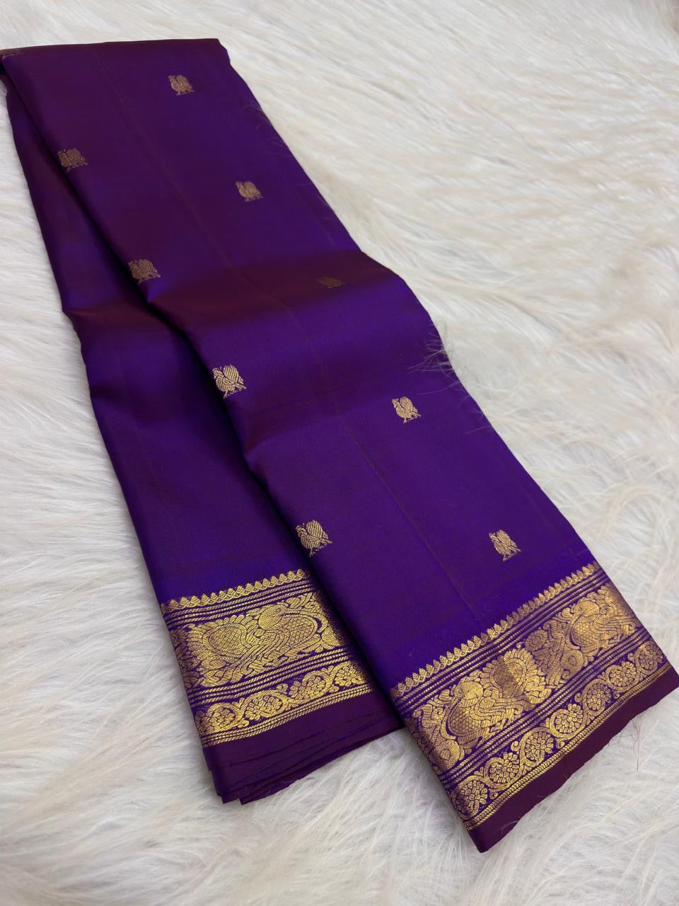 Deep Violet Purple pure silk KanchiPattu Butta saree with petite handwoven Mayil gold zari border.