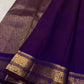 Deep Violet Kanchipuram silk saree with small individually spaced handwoven gold zari buttas.