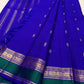 Vivid Neelam Blue and Emerald Green pure silk Kanchipuram Varisaipet saree, layered traditional border rows.