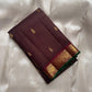 Dense silk Kanjivaram saree with smooth sheen and emerald selvedge