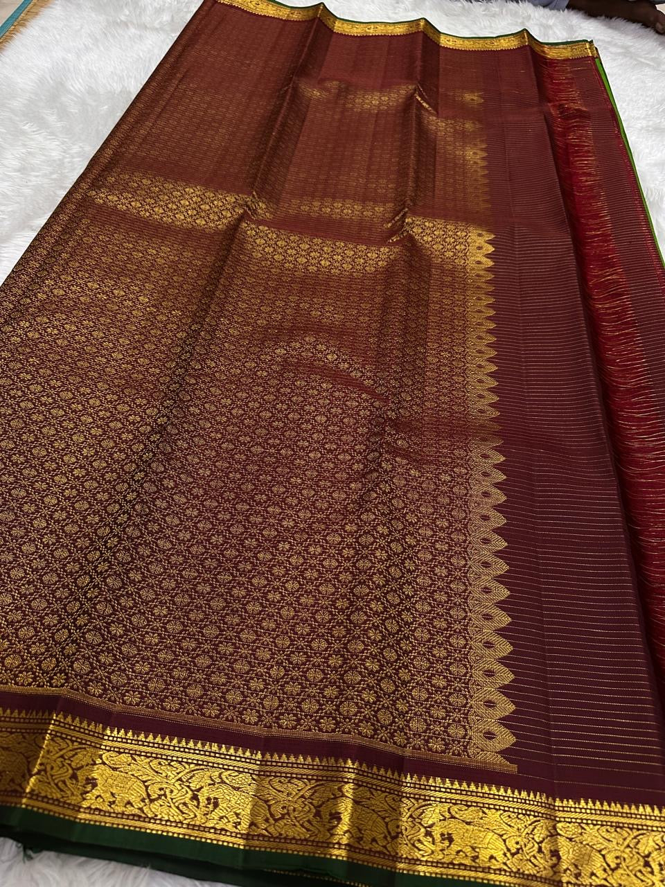 Pure Kanjivaram silk saree with wine maroon edge and green selvedge