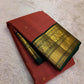 Dense silk Kanjivaram saree with smooth sheen and forest green edge