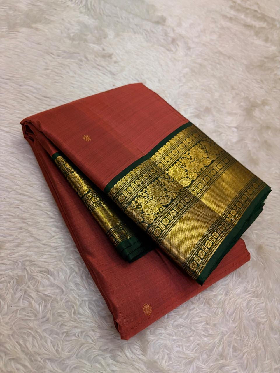 Dense silk Kanjivaram saree with smooth sheen and forest green edge