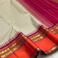 Gold zari diamond-check pallu detail on a biscuit beige and deep pink Kanchipuram silk saree