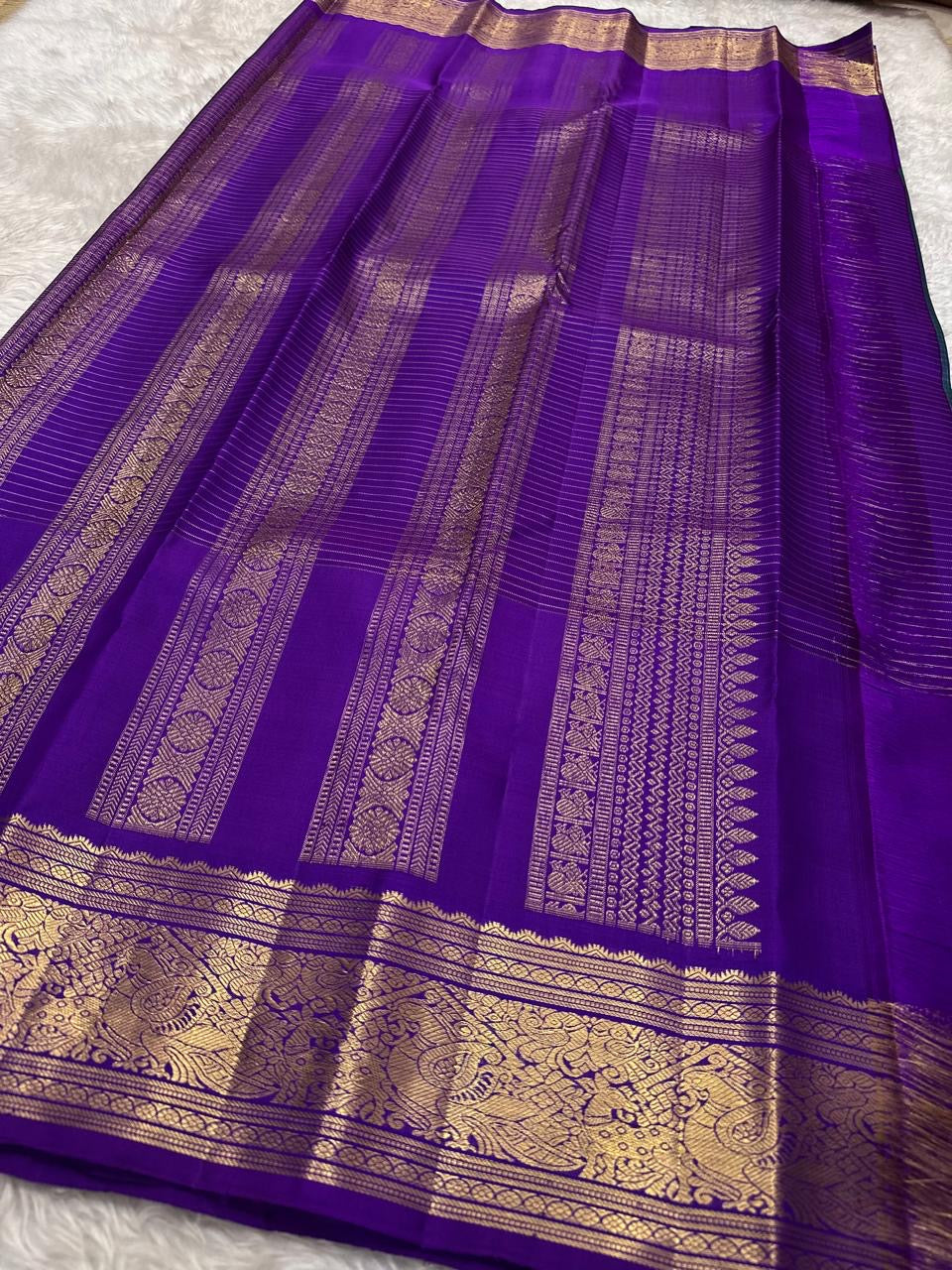 Kanchipattu silk saree in sapphire blue with orchid purple border Double Korvai weave traditional zari detail