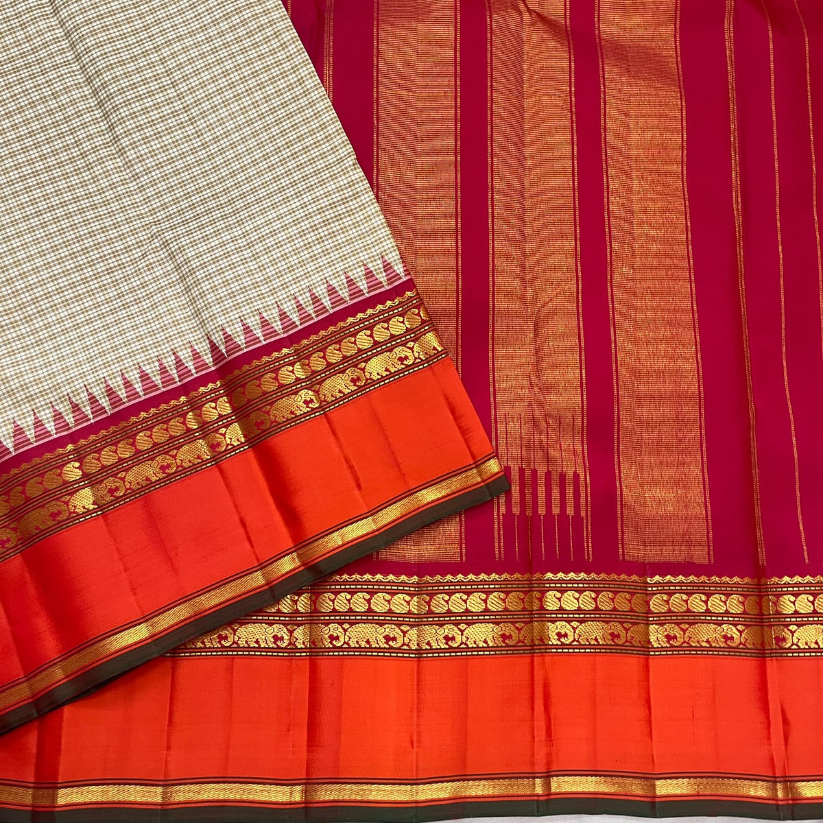 Biscuit beige Kanchipuram silk saree with contrast orange border and visible selvedge