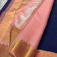 Peach pallu and blush pink border detail on Kanchipuram silk saree with gold zari woven pattern