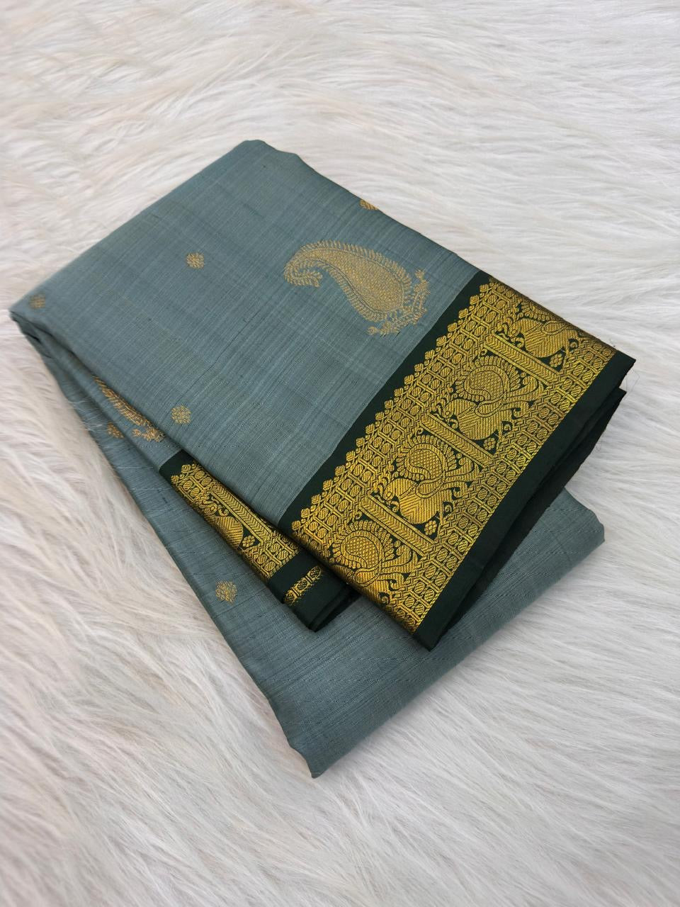 Dusty Aqua Blue pure silk Kanchi Pattu Butta saree with Deep Forest Green Mayil zari border