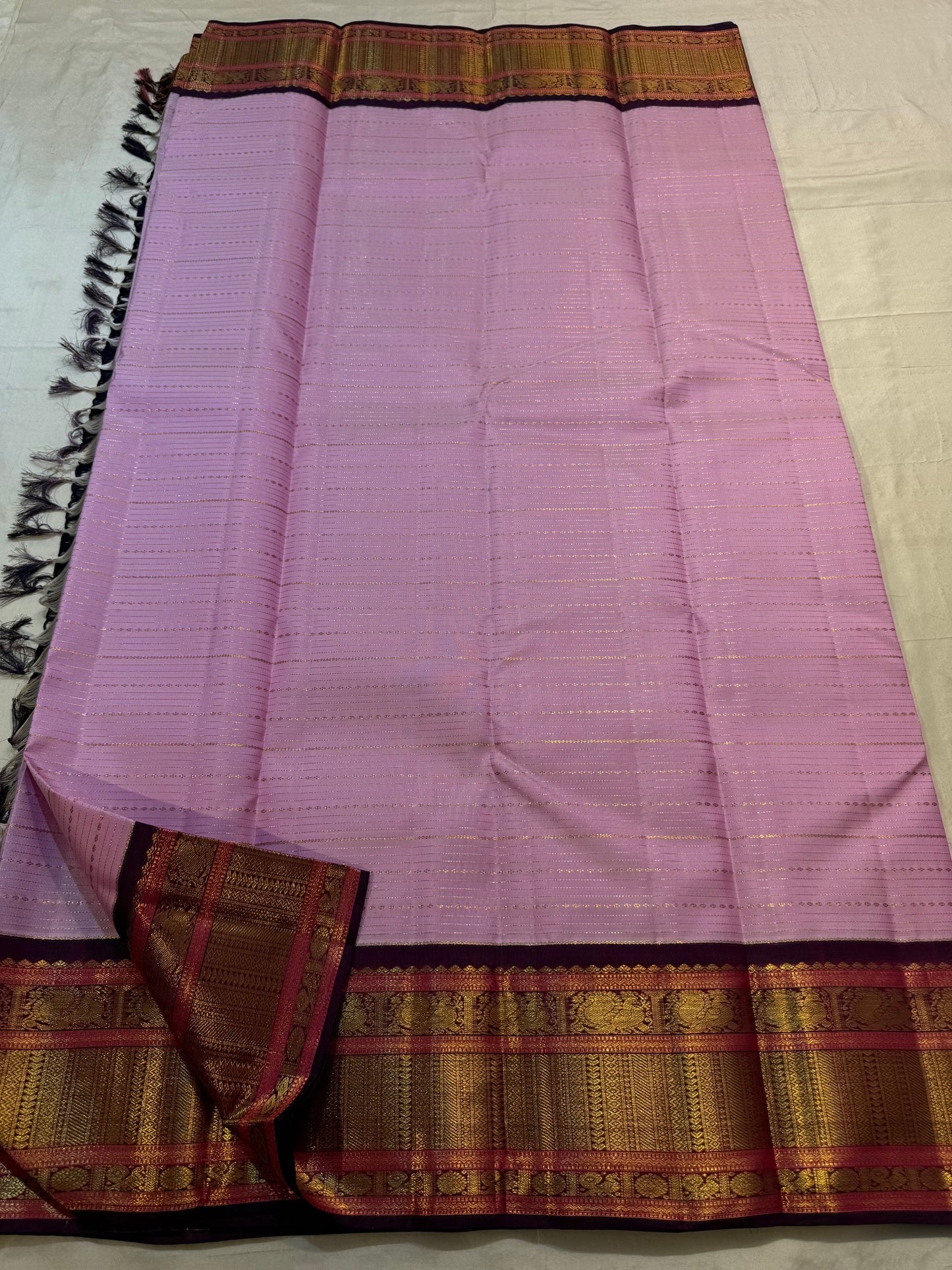 Dusty Lavender Pink pure silk Kancheepuram Korvai saree with fine Veldhari gold zari stripes.