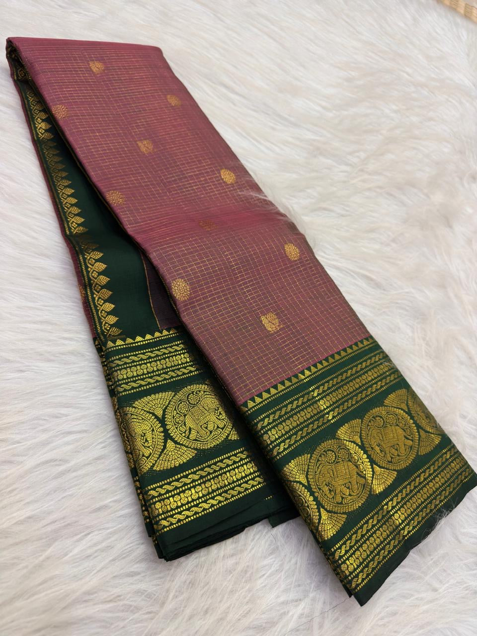 Dusty Mauve Kanchipuram Zari Kattam saree — forest green elephant medallion border close-up