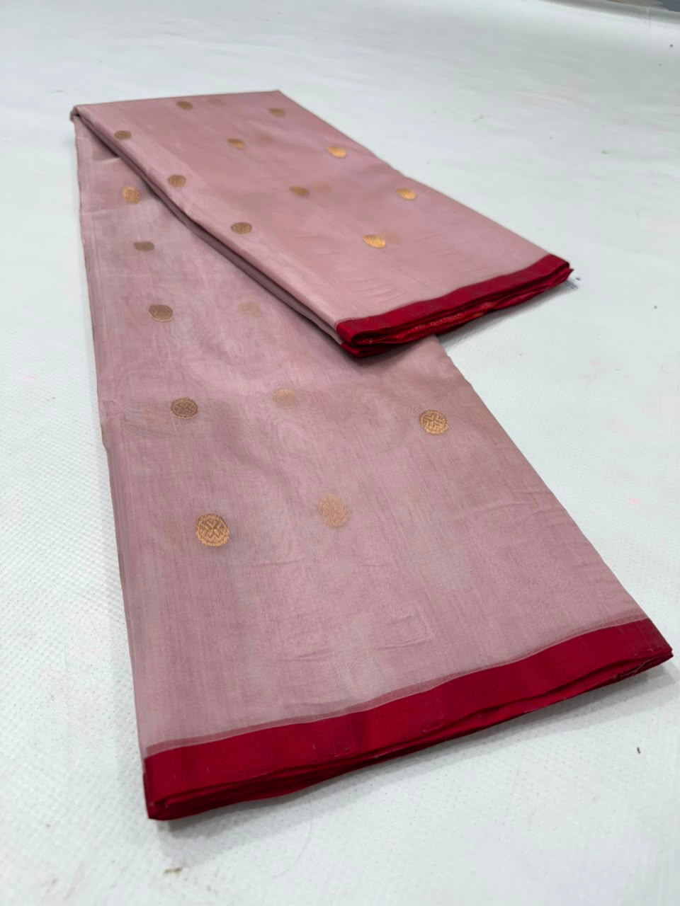 Dusty Rose Katan Silk Chanderi saree showing gold woven buttas, red edging and broad striped zari pallu