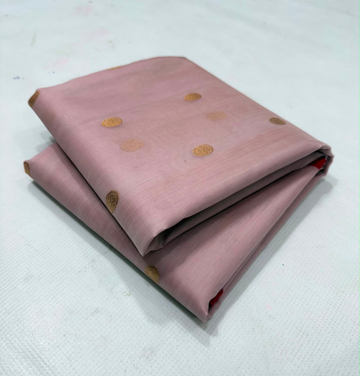 Dusty Rose handloom Chanderi saree draped, showing antique-gold buttas scattered across the body