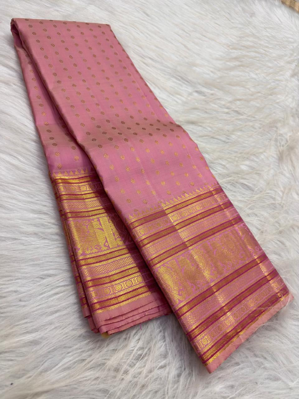 Dusty Rose handwoven pure silk Kanjivaram Butta saree — peacock motif border close-up — Idam Living