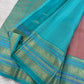 Detail of gold zari butta motif on Dusty Rose Kanjipuram Varisaipet silk saree body