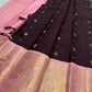 Close view of gold zari peacock motifs woven across a Dusty Rose Pink Kanchipuram Korvai border.