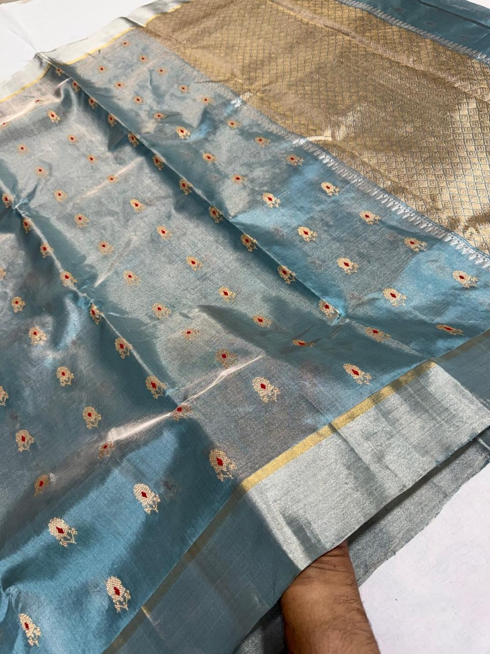 Dusty Steel Blue Tissue Pattu Silk Chanderi saree with gold and red motifs, silver border and geometric metallic pallu