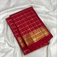 Double Muthu Seer zari lattice on a vermilion Kanchi Pattu saree