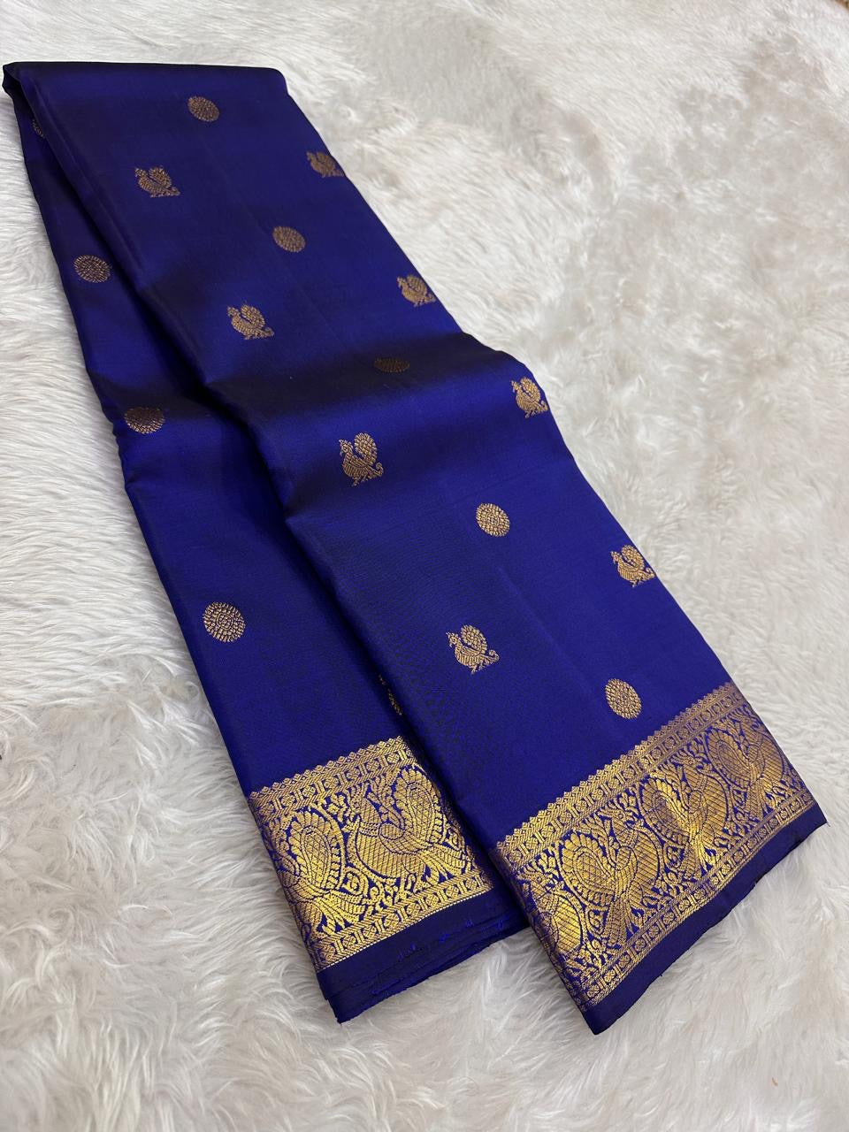 Pure silk Kanchivaram saree with ornate peacock border woven in antique gold zari
