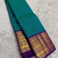 Handwoven Kanjeevaram Korvai saree featuring petrol blue body and vivid orchid purple pallu